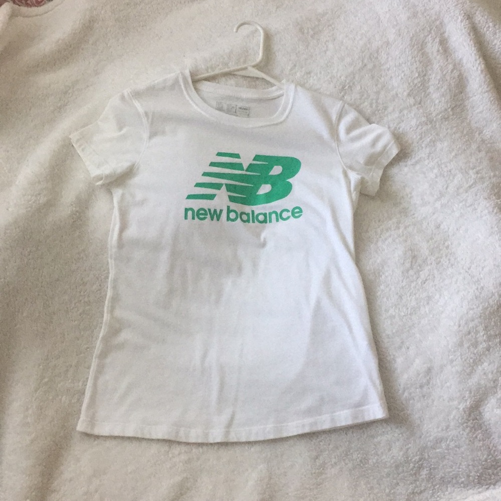 White and green New Balance tee.